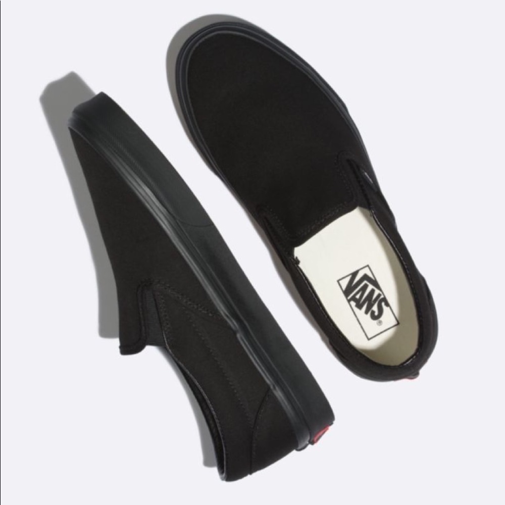 All black slip on vans